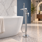 Charlotte chrome floorstanding bath shower mixer with stick handset and hose beside a white freestanding bath in a showroom.