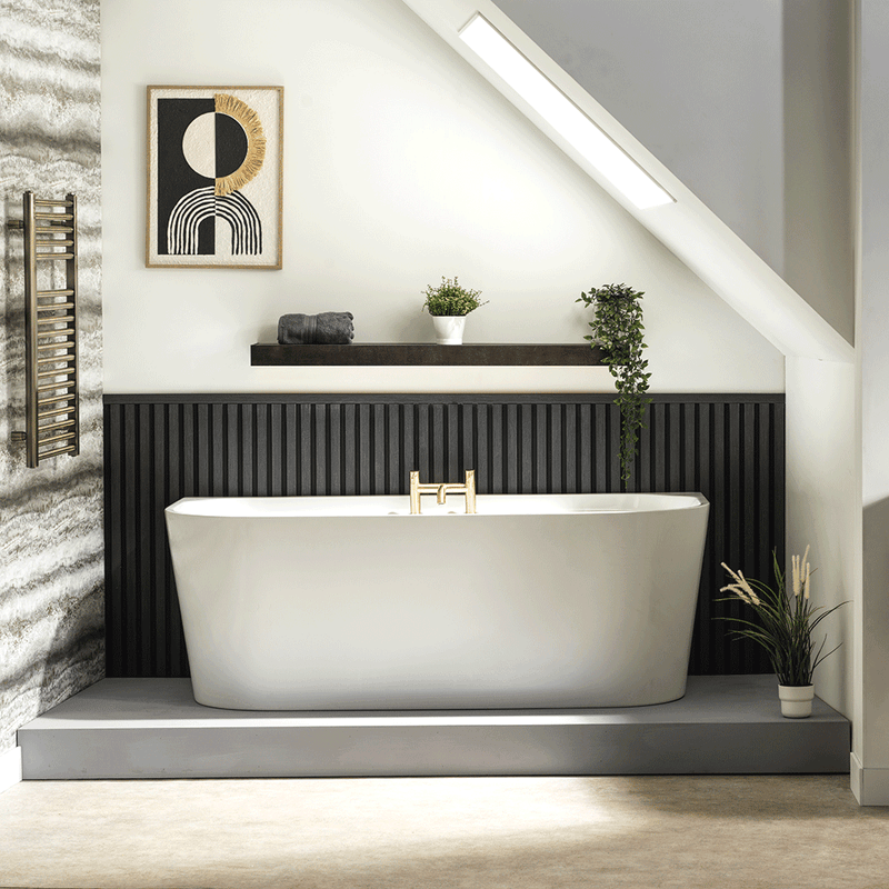 White Tima rectangular freestanding bath with tapered sides in a black and white bathroom with grey and cream flooring